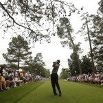 Tiger Woods of the U.S. hits his tee shot on the ninth hole during first round play in the 2013 Masters golf tournament in Augusta