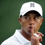 Tiger Woods of the United States gestures to a fan to be quiet from the fifth green during first round play at the WGC Bridgestone Invitational golf tournament in Akron